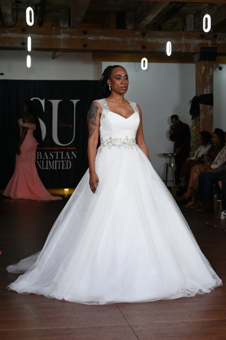 A tulle ball gown with a beaded floral waist and jewelled straps